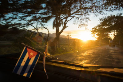 Close-up of flag against sky during sunset