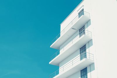 Low angle view of building against clear blue sky