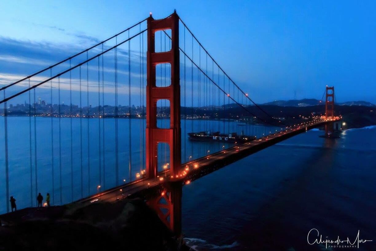 GOLDEN GATE BRIDGE OVER RIVER AGAINST SKY