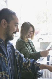 Young couple shopping for records together