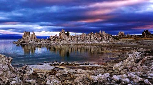 Scenic view of mountains against cloudy sky