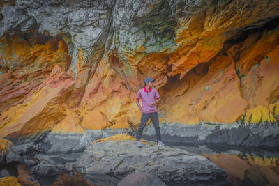 Woman standing on rock