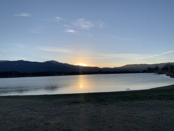 Scenic view of lake against sky during sunset