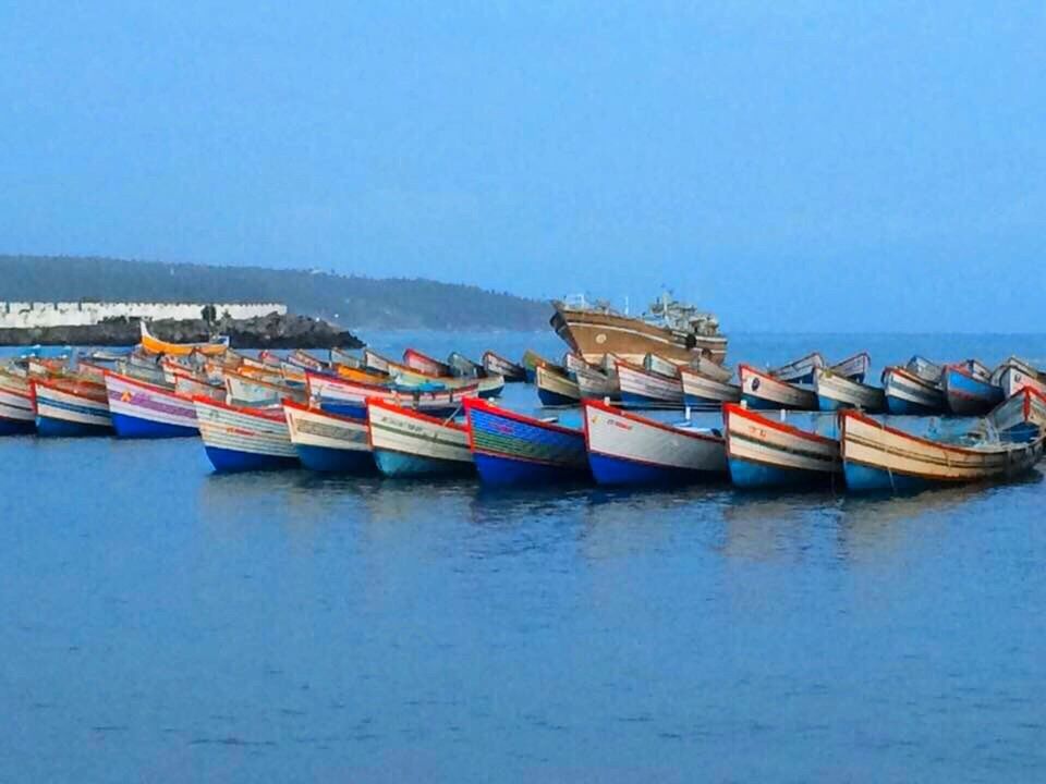 BOATS IN SEA AGAINST CLEAR SKY