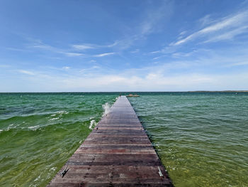 Nantucket beach scene,  jetty in the sea