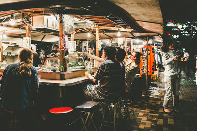 People at street market in city at night