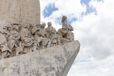 Monument to the discoveries against cloudy sky