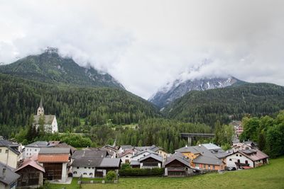 Houses and buildings against sky