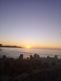 Scenic view of sea against clear sky during sunset