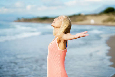 Woman standing on beach