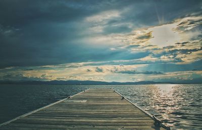 Pier over sea against sky