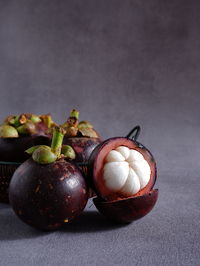 Close-up of fresh ripe mangosteen on table