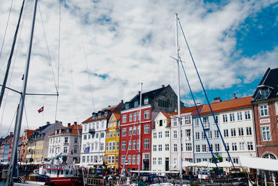 Houses against sky in city