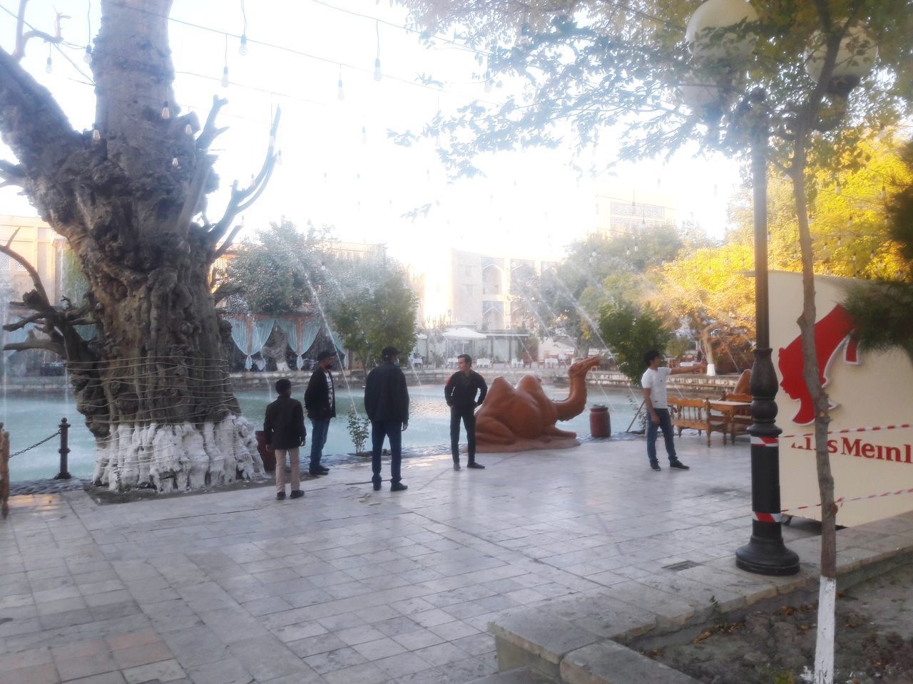 GROUP OF PEOPLE WALKING ON FOOTPATH