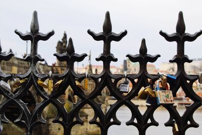 Close-up of metal fence against building