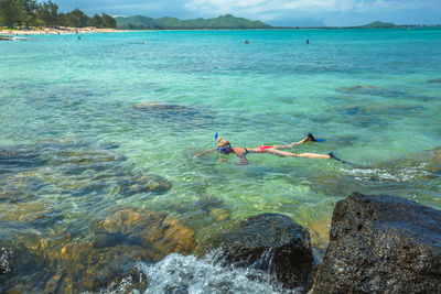 Woman snorkeling in sea