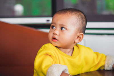 Close-up of a cute baby boy at home