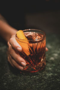 Close-up of hand holding drink