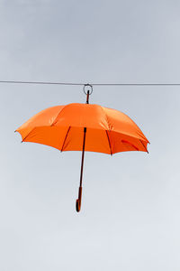 Umbrella hanging from line