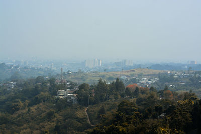 High angle view of buildings in city against sky