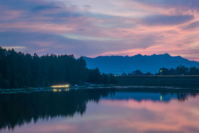 Scenic view of lake against sky during sunset