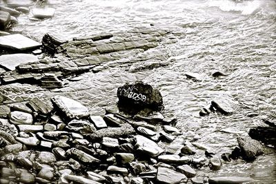 Stone wall with rocks in background