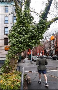 Man walking on road in city