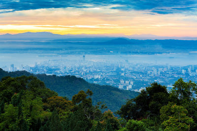 Scenic view of landscape against sky at sunset