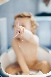 Midsection of woman sitting on floor