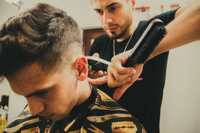 Berber cutting hair