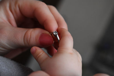 Close-up of hand holding hands