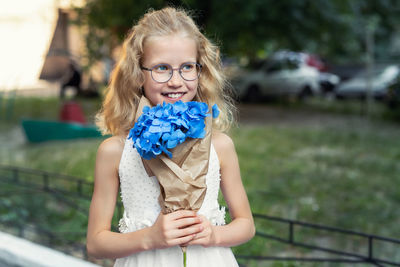 Cute girl holding bouquet 