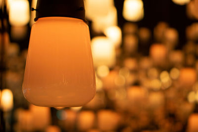 Close-up of illuminated light bulb