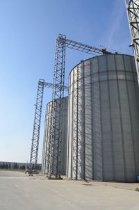 Low angle view of crane against clear sky