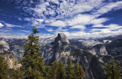 Scenic view of mountains against cloudy sky