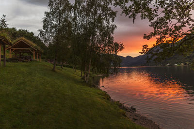 Scenic view of lake against sky during sunset