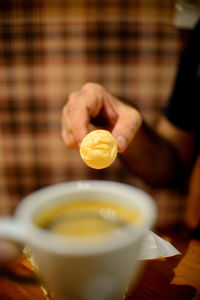 Close-up of hand holding ice cream