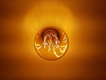 Close-up of illuminated light bulb