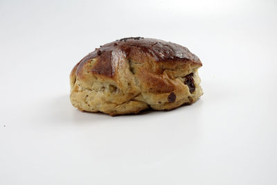 Close-up of bread against white background