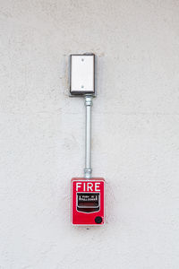 Close-up of electric lamp on wall