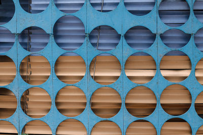 Full frame shot of blue and yellow metal circles pattern