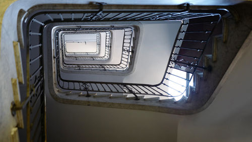 Directly below shot of spiral staircase in building