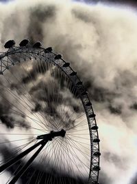 Low angle view of ferris wheel against sky