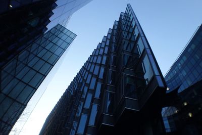 Low angle view of skyscrapers against clear sky