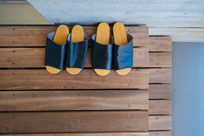 High angle view of shoes on wooden floor