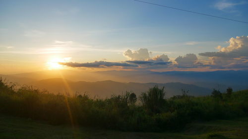 Scenic view of landscape against sky during sunset