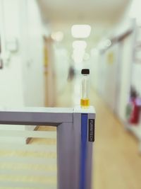 Liquid in bottle on railing at hospital