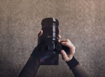 Close-up of hand holding camera