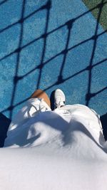 Beautiful fence shadows on blue ground, summer, take a walk,  park, tennis,high angle view, woman