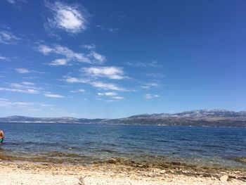 Scenic view of sea against blue sky